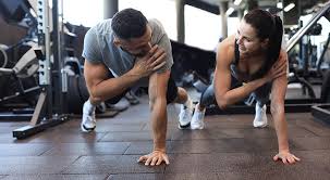 Toning Bingo Wings: Your Ultimate Guide to Sculpting Sleek Arms at the Gym 3 Fitness trainer demonstrating arm toning exercises Dudley